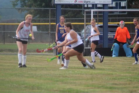 Courtney Hyde (19), Charlie Davis (8), and Cheyenne Connors (23) keep up an aggressive offense.