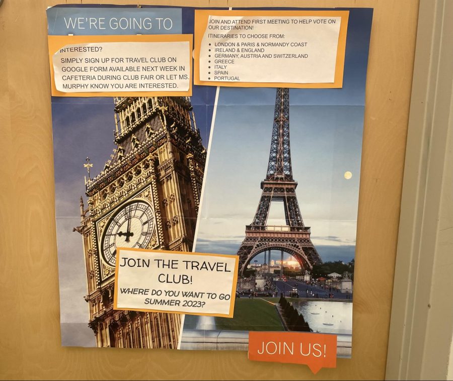 The+Travel+Club+poster+outside+of+Samantha+Murphys+door+encourages+students+to+join.+