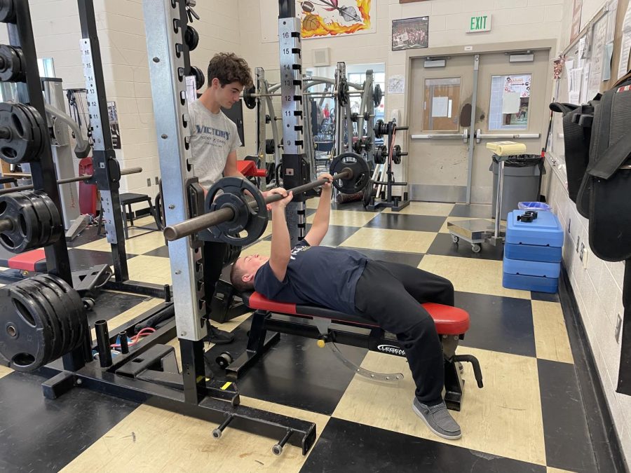 Freshmen Declan Lockwood and Ben Teslenko build their strength through weightlifting.