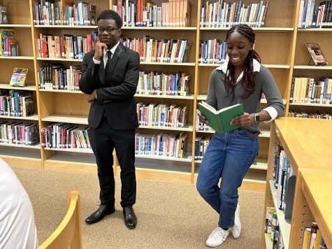 (Left to right) Senior Victor Onabanjo portrays Malcolm X and sophomore Josslyn Quansah performs as Ruby Bridges in Linganores first Blacks in Wax Museum.