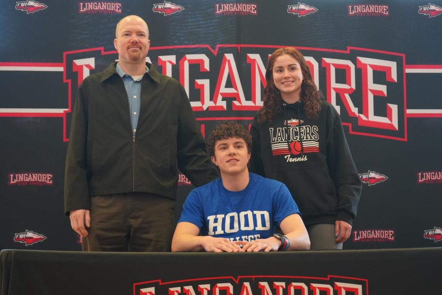 Brady Vlha poses with his family after signing his National Letter of Intent to Hood College. (Pictured left to right: Greg Vlha, Brady Vlha and Genevieve Vlha.)