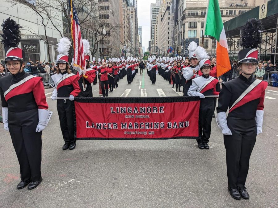 The Linganore Band sets their parade block at the beginning of the parade route on 5th Avenue.