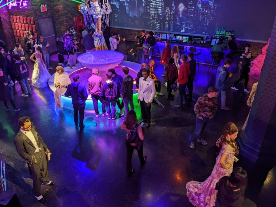 Students mingle with wax figures of popular celebrities on the Met Gala floor of Madame Tussauds New York City.