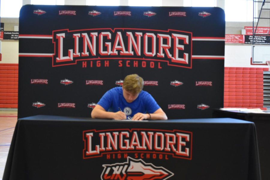 Andrew Bailey signs his National Letter of Intent to play soccer at Wilson College. 