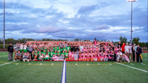 Linganore juniors and seniors come together for a picture after the schools first powderpuff game.