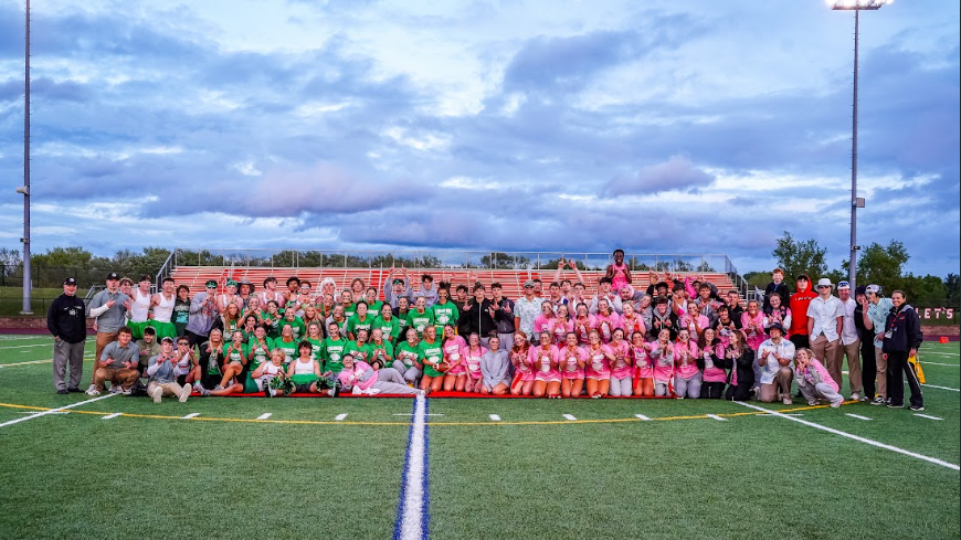 Linganore juniors and seniors come together for a picture after the schools first powderpuff game.