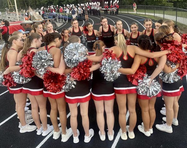 Before every preformance, the Linganore poms team get in a huddle to get hyped for the dance.