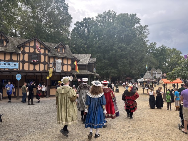 The+Court+of+Royals+is+seen+walking+through+the+hay+path+of+the+Renaissance+Festival.+