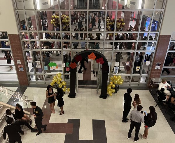A DIY harvest-themed arch welcomed the Homecoming court into the schools cafeteria, which served as the dance floor.