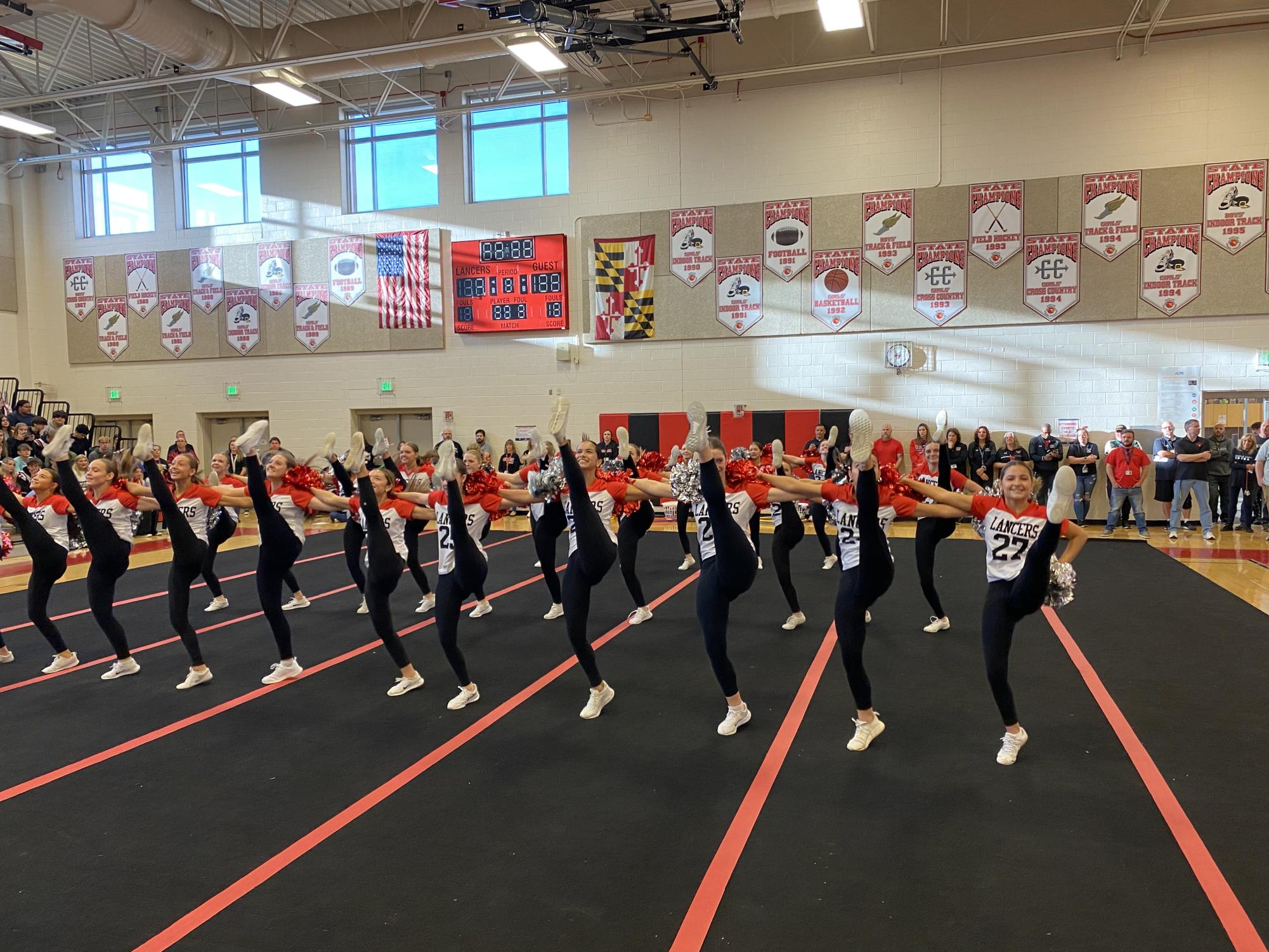 LHS Pom and Dance performs a kick-line during their routine at pep rally. 