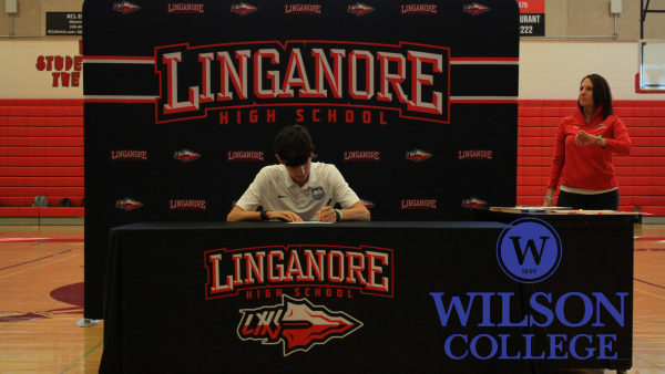 Chris Natale signs his National Letter of Intent to play soccer at Wilson College next fall. 