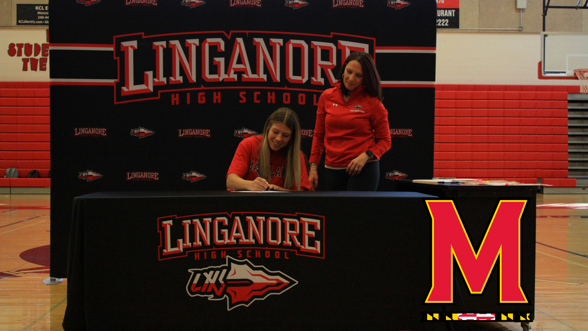 Gracie Wilson signs her National Letter of Intent to play softball at the University of Maryland next fall.