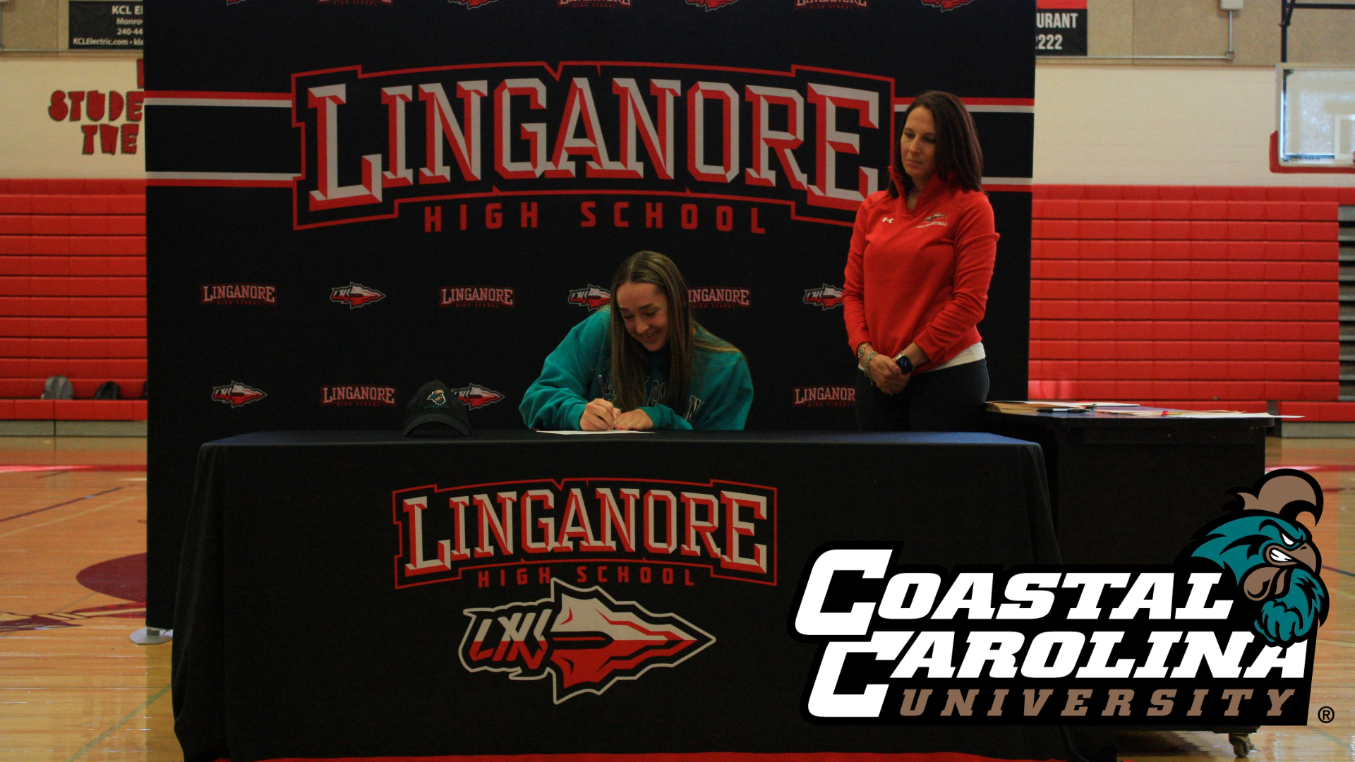 Megan Hummel signs her National Letter of Intent to play womens lacrosse at Coastal Carolina University next fall.