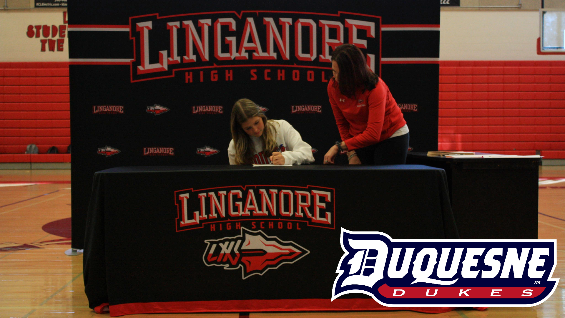 Sienna Johnson signs her National Letter of Intent to be a part of the acrobatics team at Duquesne University next fall.