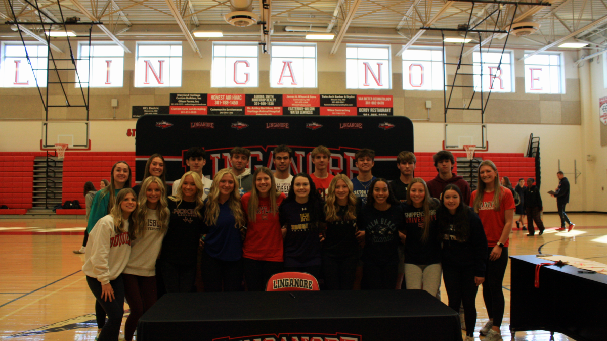 Senior+athletes+who+signed+their+National+Letters+of+Intent+pose+for+a+photo+after+the+ceremony.