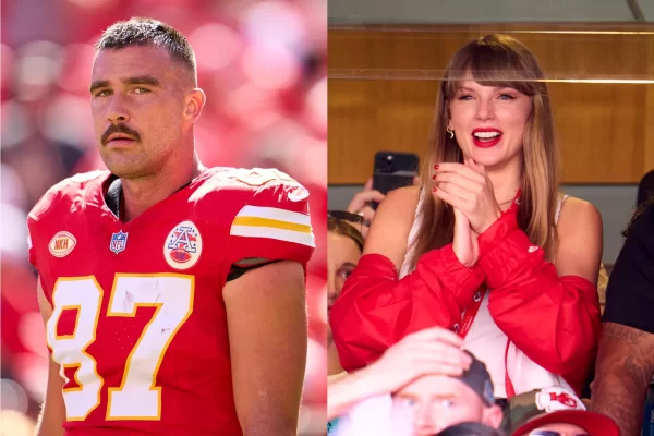 Taylor Swift wears a smile while Travis Kelce takes the field at Arrowhead Stadium. (Cooper Neill/Getty Images)