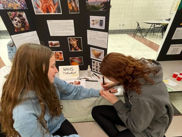The National Art Honor Society booth drew traditional henna designs on attendees throughout the night.  