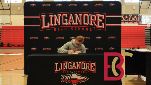 Linganore senior Nathan groves signing his National Letter of Intent to play lacrosse at Bridgewater College.