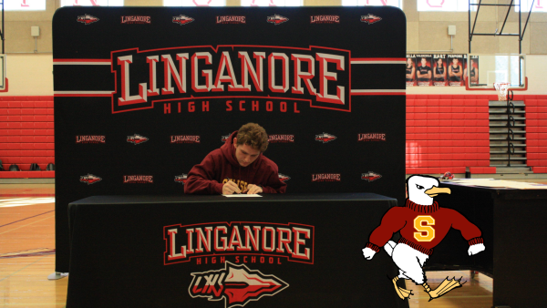 Andrew Moxley signs his National Letter of Intent to continue running at Salisbury University. 
