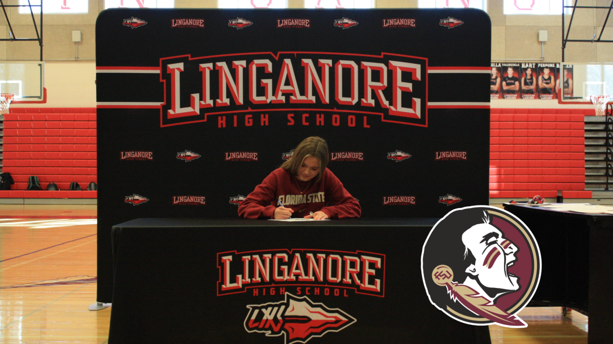 Peyton Orlando signs her letter of intent to swim competitively at Florida State University