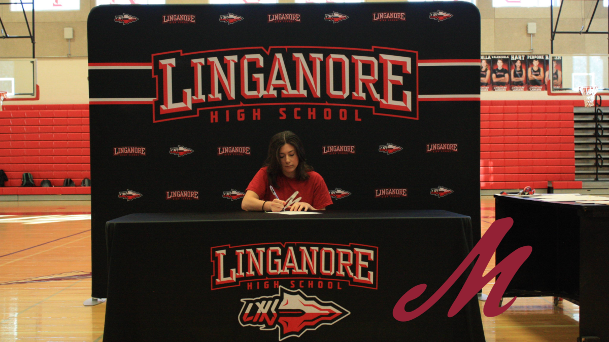 Alexis Hardy signing her National Letter of Intent to play softball at Muhlenburg College.