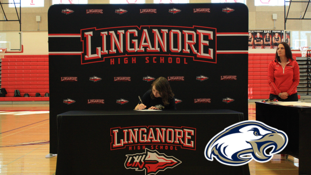 Emma Arnold signs her National Letter of Intent to play soccer for Juniata College. 