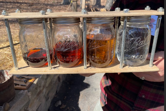 A display jar demonstrated how sugar condenses and darkens whilst being boiled into maple syrup.
