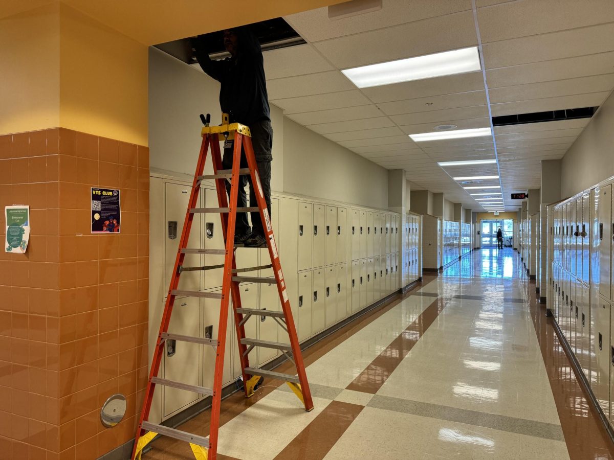 FCPS Security and Management team enhances surveillance with new 360-degree cameras at a hallway intersection in Linganore High School.