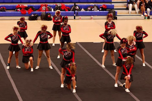 Linganore varsity cheer takes to floor and prepares to compete for the last time in the Winter 2024 season. (Tino Pham)