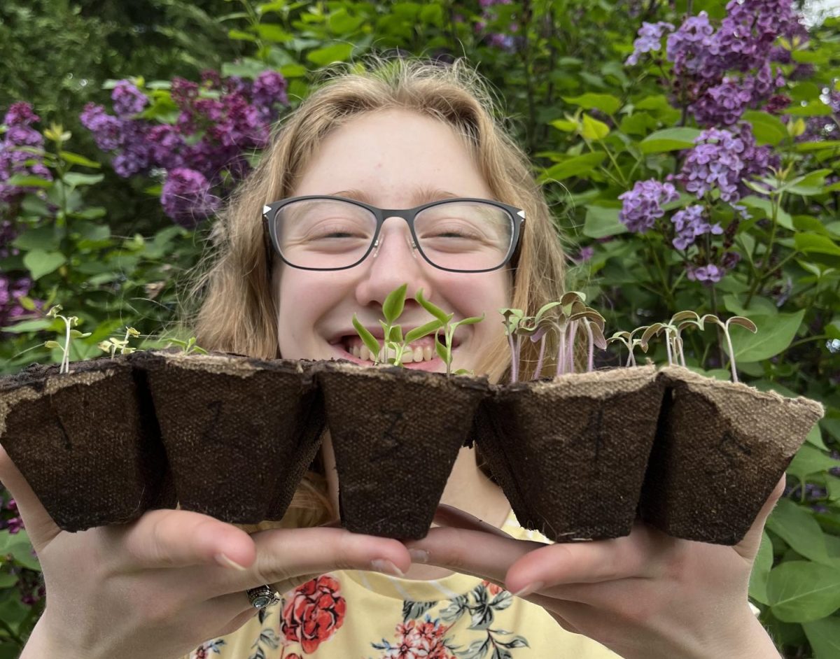 Senior Abby Etherton poses with seedlings. Ethertons specialty for the competition is soil (Courtesy of Abby Etherton, used with permission). 