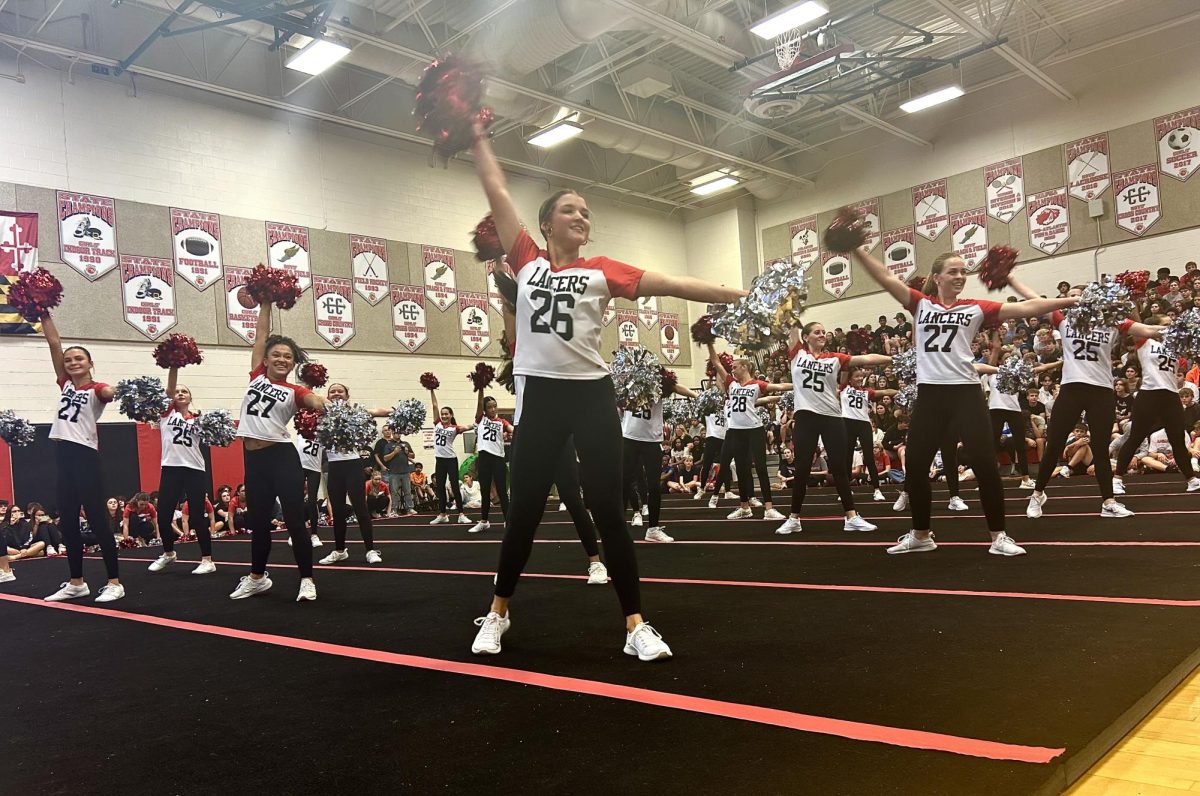 Junior Elizabeth Van Meter dances during pep rally in the Pom and Dance performance. 