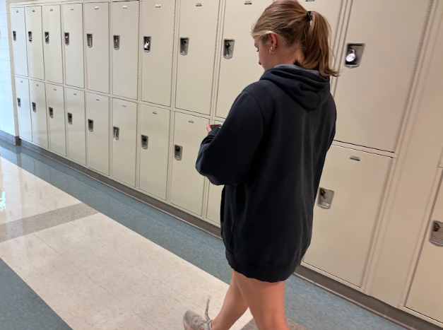 Junior Jordan Shipley is seen walking in the hallway wearing an outfit that violated proper dress code policy. Students should have shorts that go down to their fingertips.