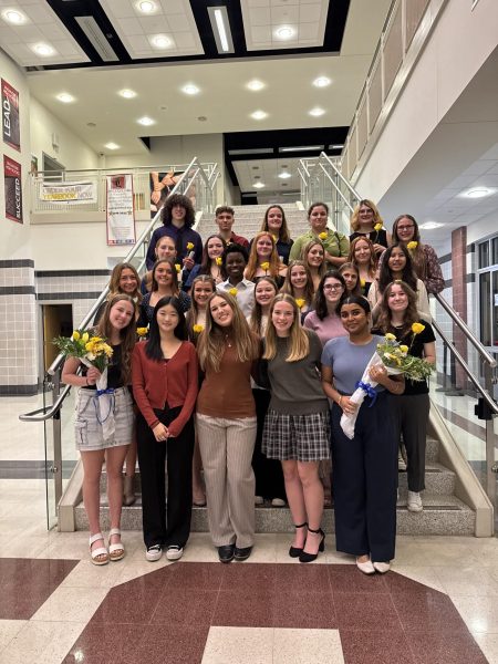 The new NEHS inductees and officers pose for a picture on the main street stairwell.