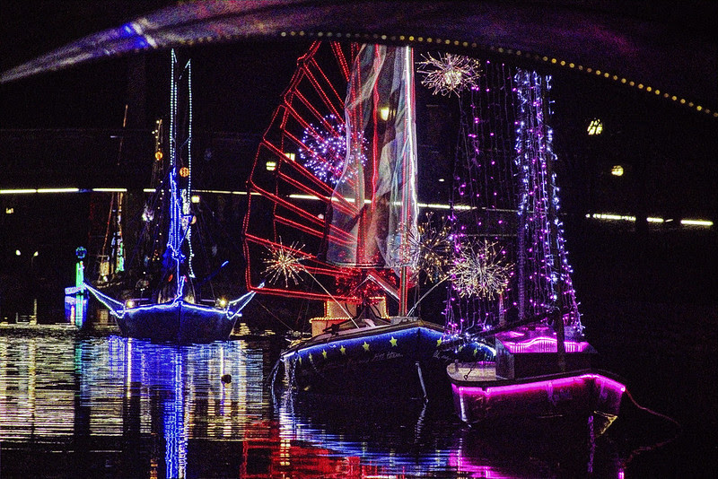 Brightly lit boats drift along Carroll Creek, adding a festive glow to the waters. 
https://downtownfrederick.org/event/sailing-through-the-winter-solstice-by-color-on-the-creek/