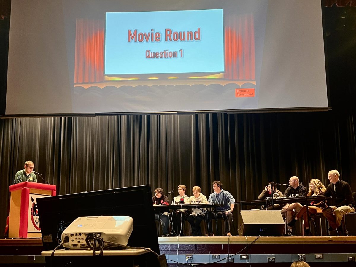 Trivia contest. Kenneth Halter, mathematics teacher at Linganore, on the left. Students in the middle, and teachers on the right.