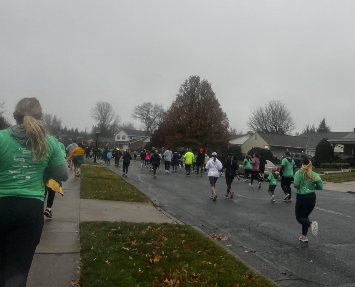 Turkey Trot participants running through Baker Park.