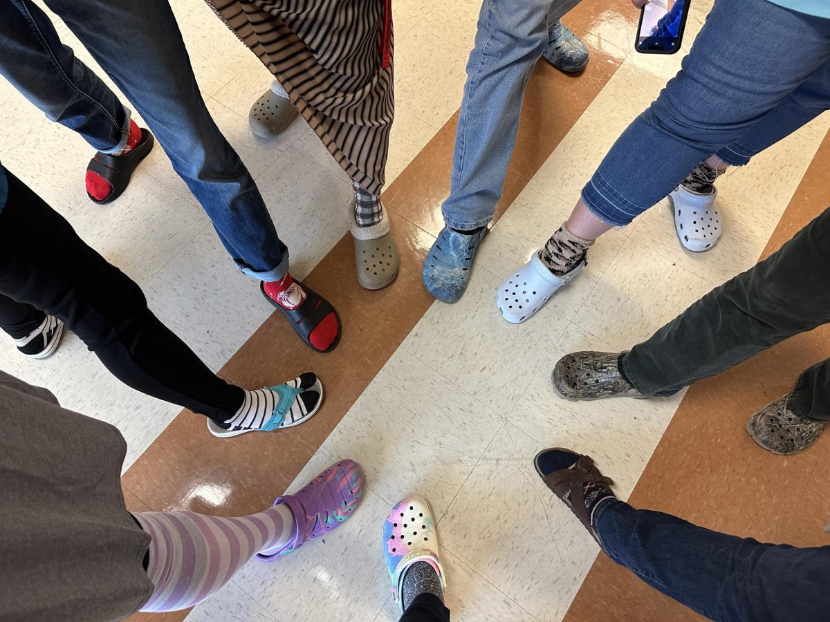 Teachers at LHS show their socks for socks day.