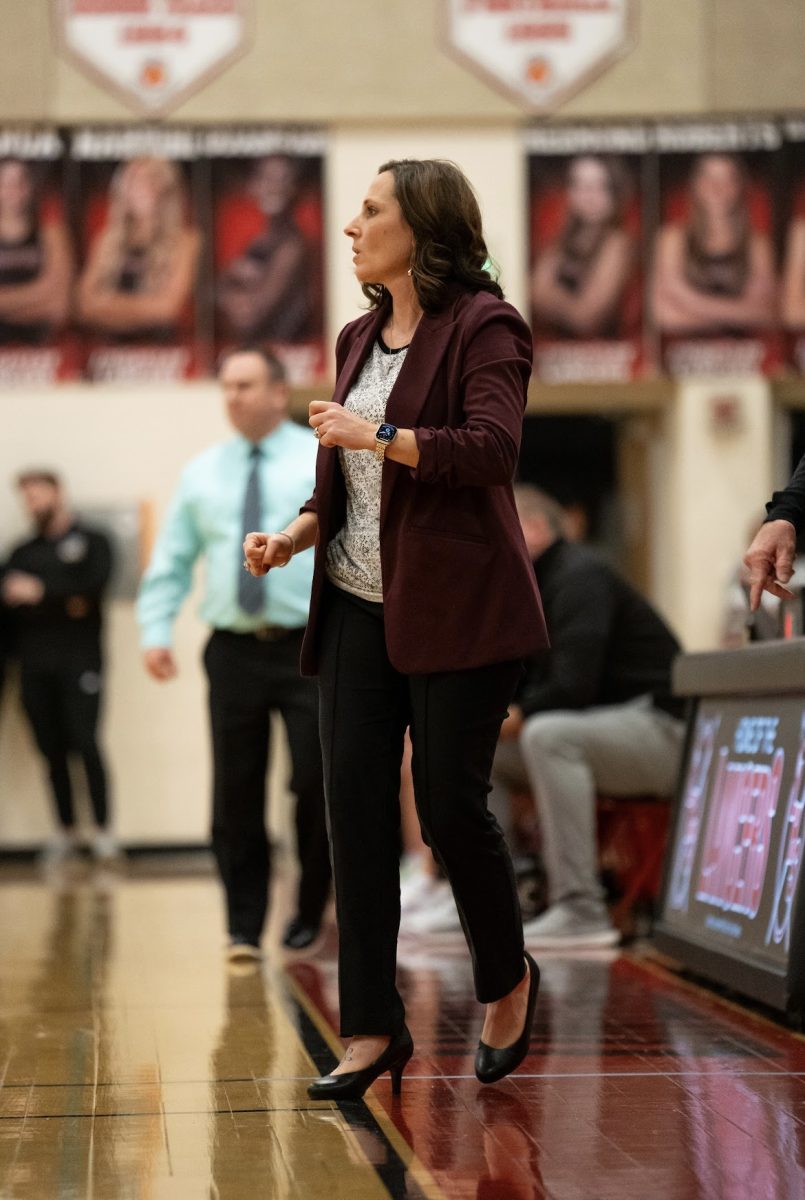 LHS PE teacher Rachael Easterday coaches the girls' varsity basketball team in the game versus Oakdale. (Courtesy of Aubrey Beale -- used with permission)