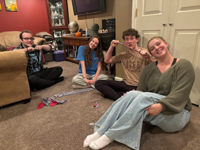 Linganore journalism students and Conner Gearheart, a Walkerville High School student all pose for a photo with their work.  (Olivia Morgan)