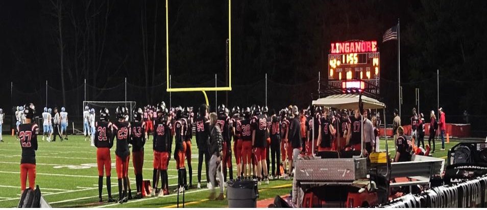 Linganore Lancers stand on the sidelines watching the game against the Westminster Senior Owls. 