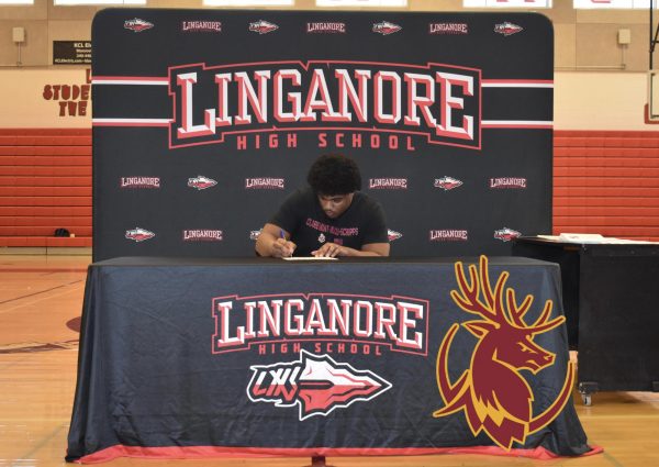 Alex Lambert signs his National Letter of Intent to play football at Claremont McKenna College.