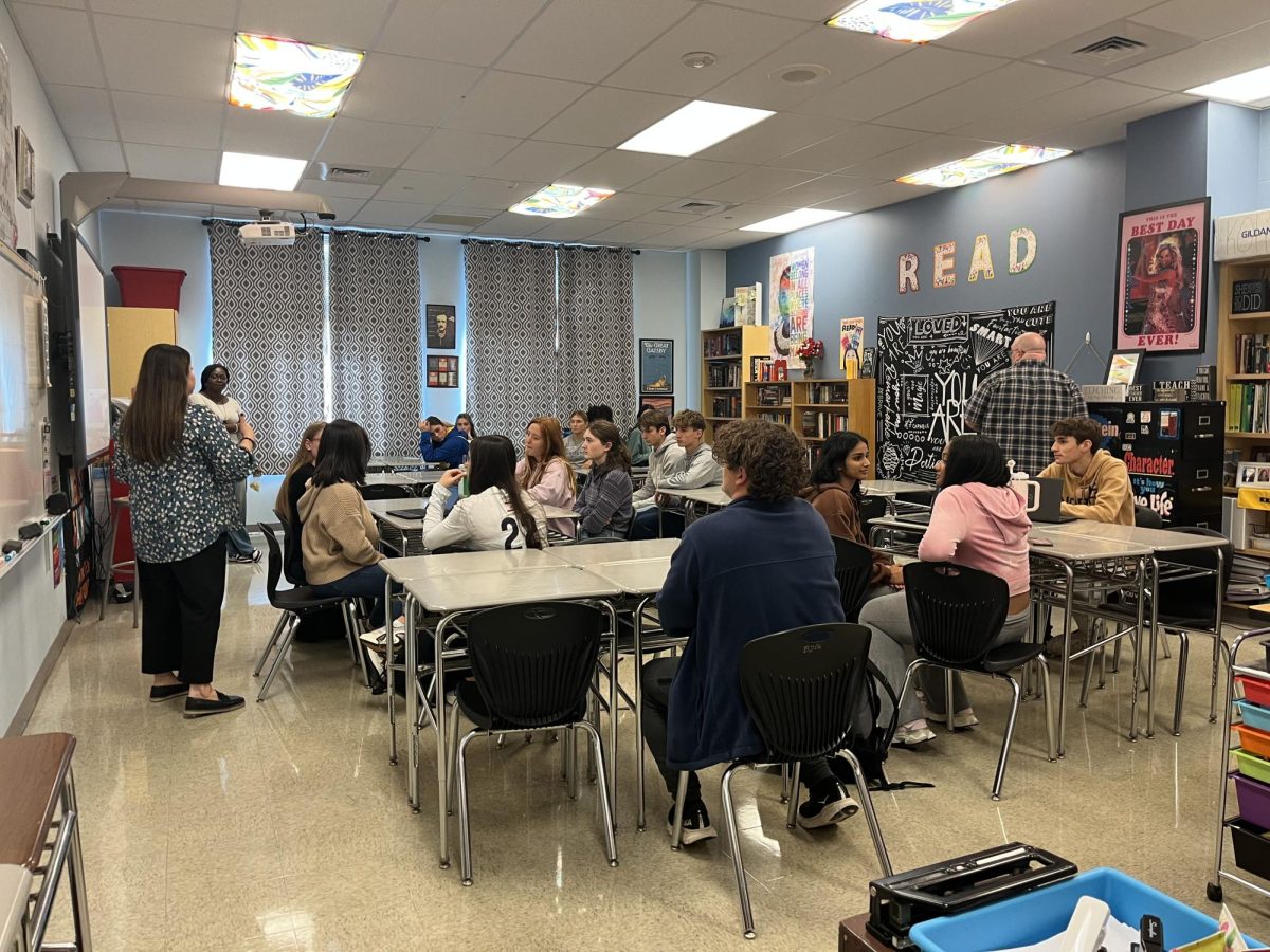 Teacher Mrs. Kolias going over the recording process with club members.