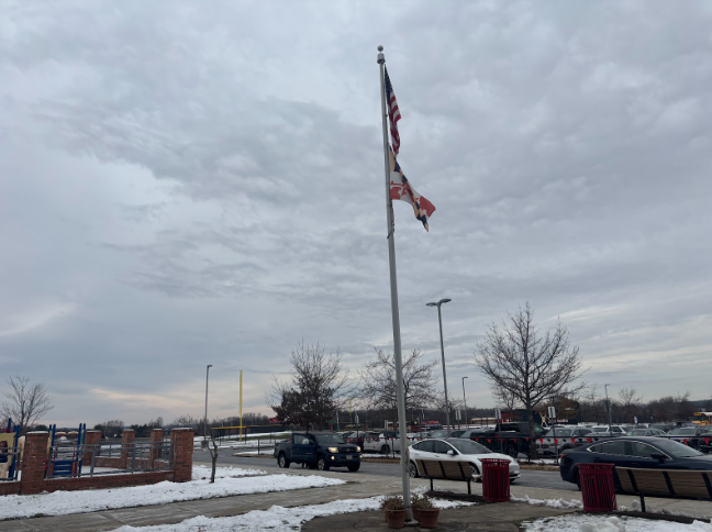 The Maryland flag waves in the wind in front of Linganore High School