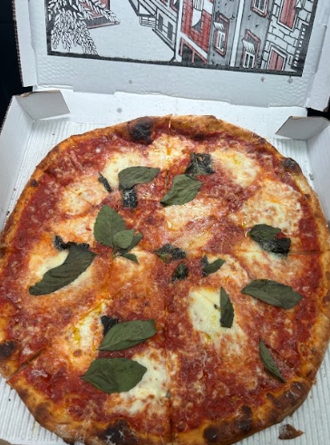 Margherita Pizza, with fresh mozzarella, basil, tomato sauce.