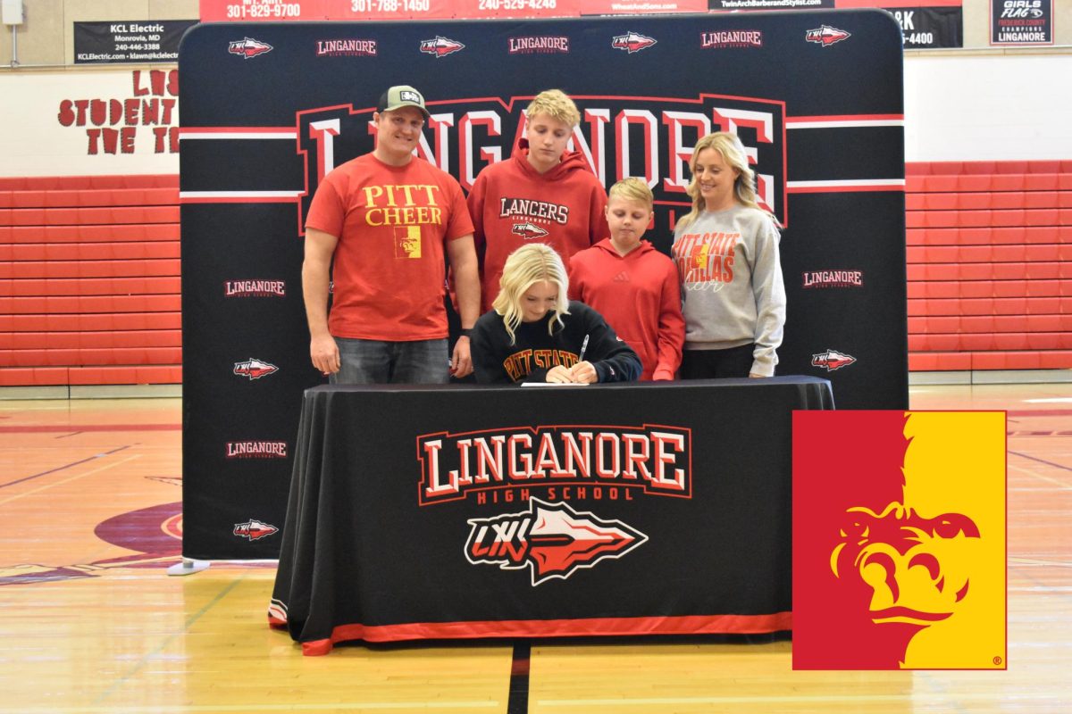 Leah Doornik signs her National Letter of Intent to continue her cheerleading career at Pittsburg State University. 