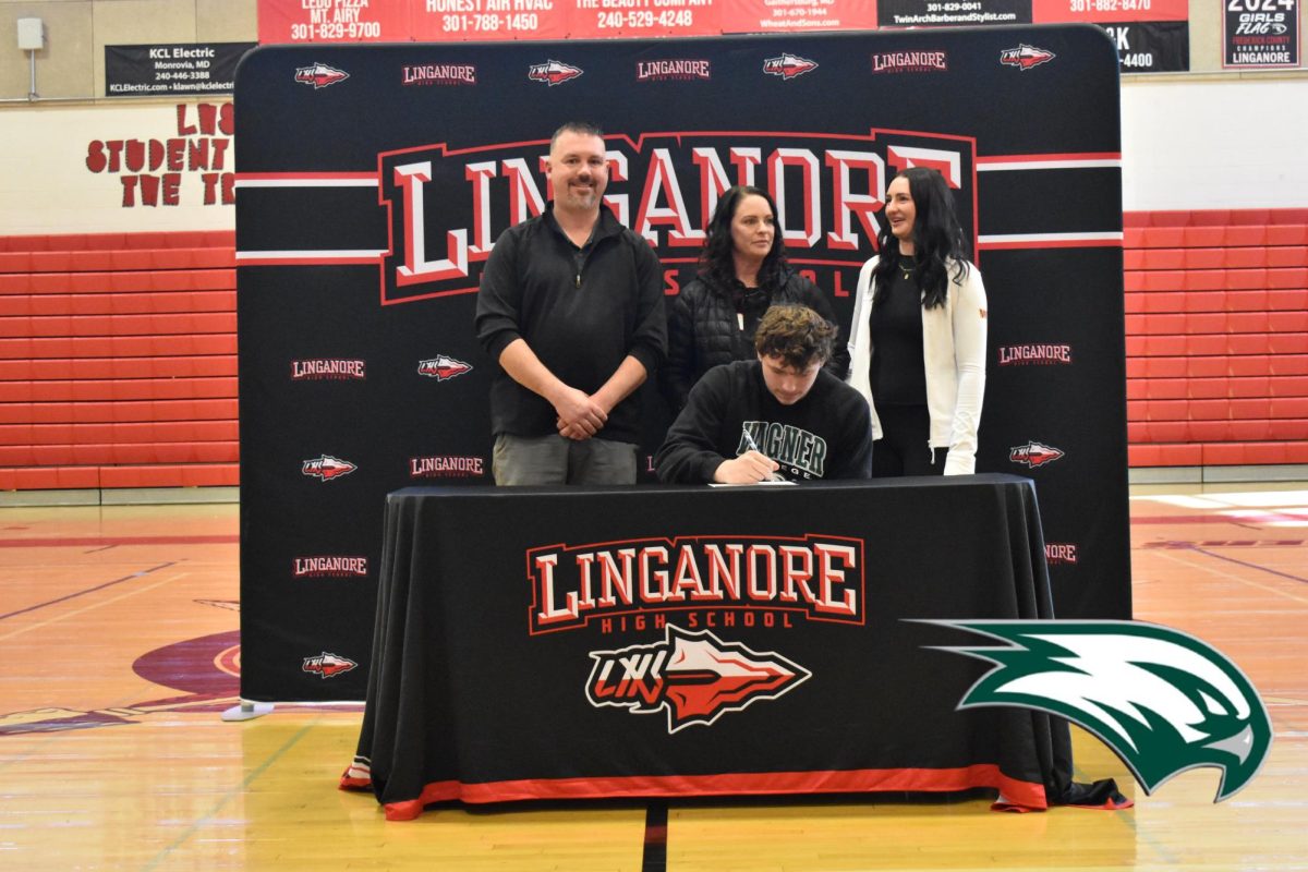 Jeremy Allen signs his National Letter of Intent to play football at Wagner College.
