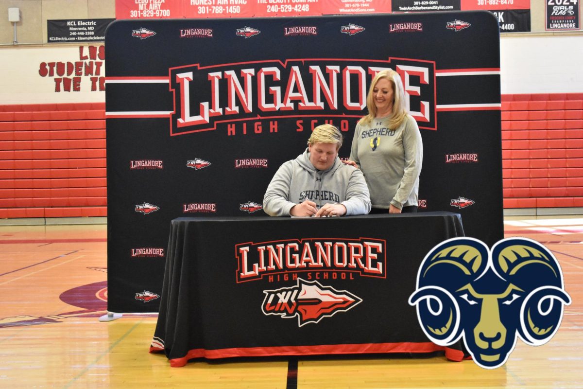 Calvin Ruch signs his National Letter of Intent to continue playing football at Shepherd University