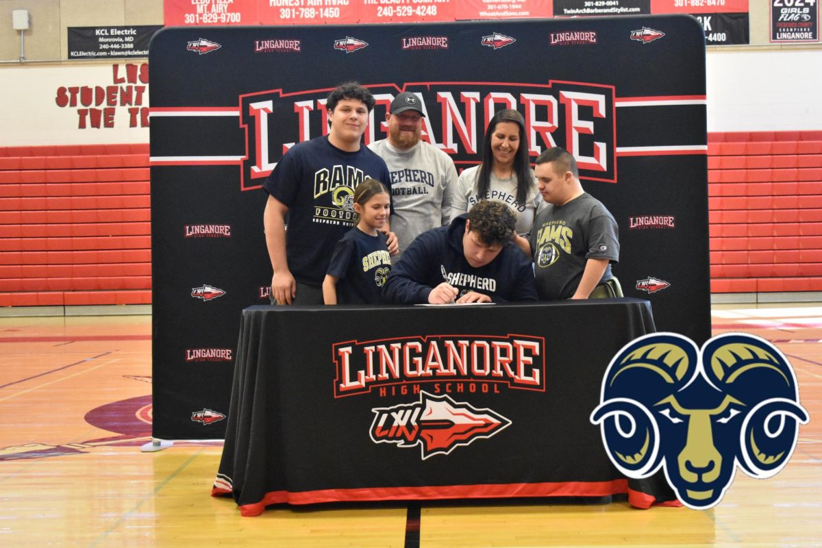 Dylan Shown signs his National Letter of Intent to play football at Shepherd University.