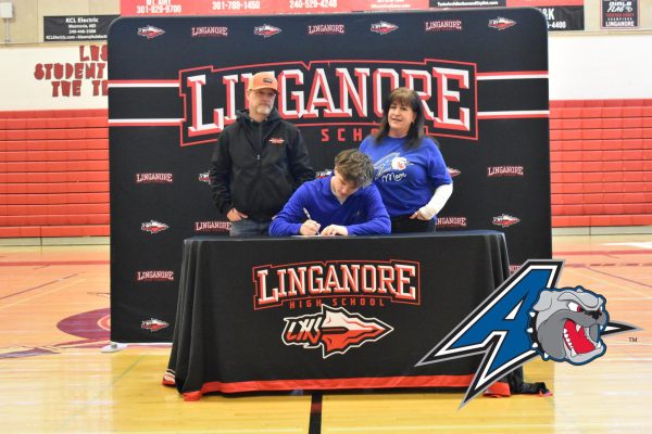 Chase Perry signs his National Letter of Intent to play baseball at University of North Carolina, Ashville.