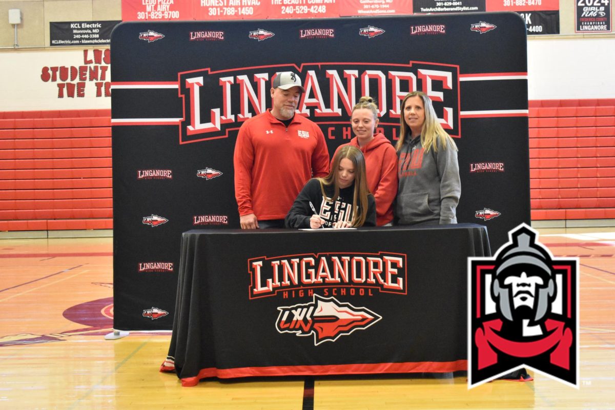 Bradyn Mackay signs the National Letter of Intent to attend Frostburg State University to continue softball athletic career.